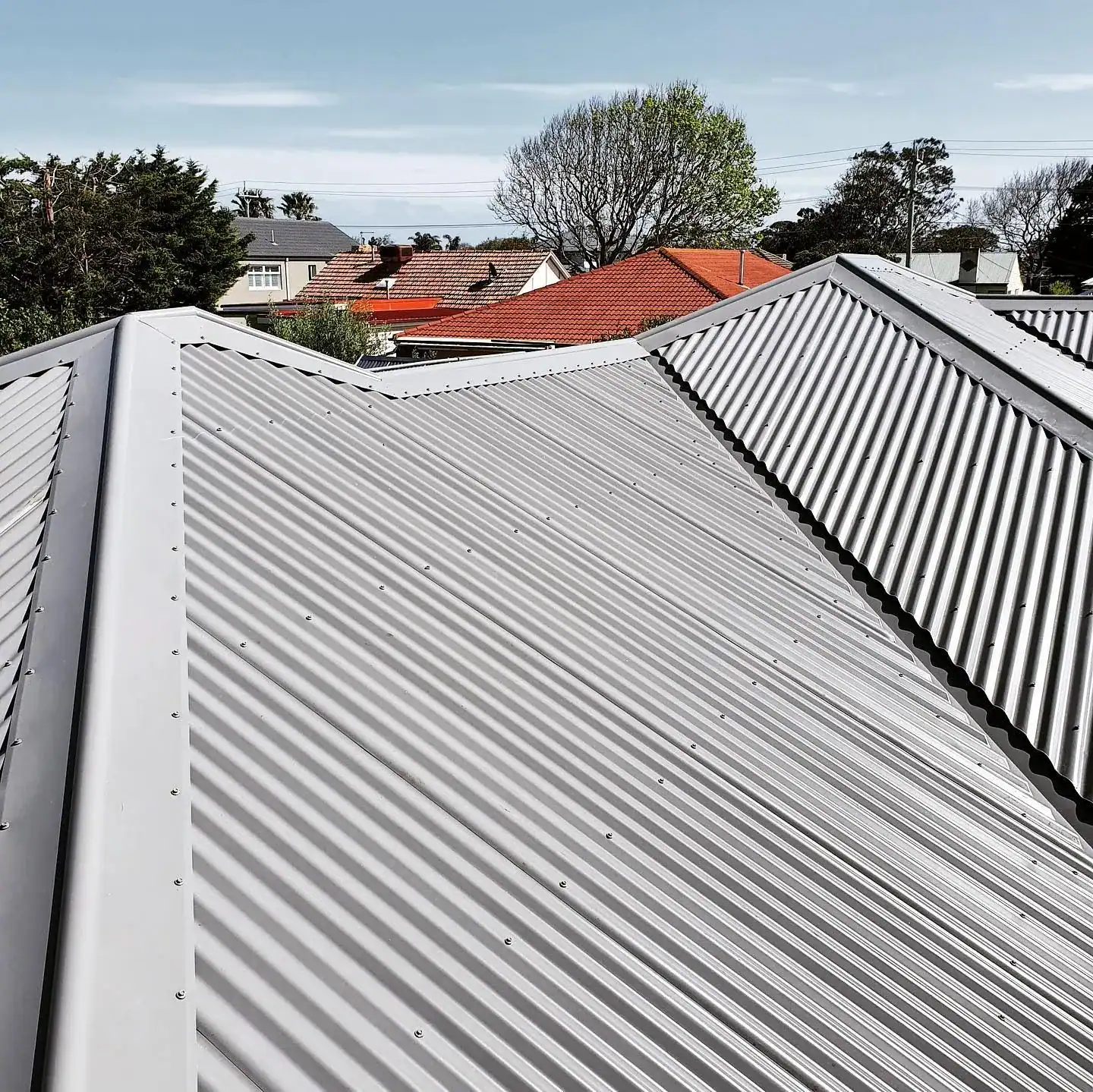 New metal roof installation on a residential home for durability and weather resistance.